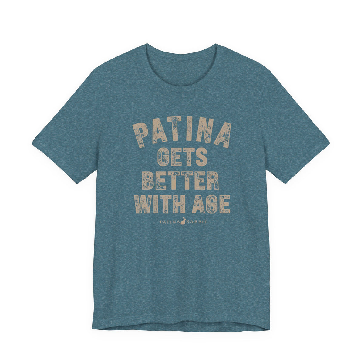 A heathered teal crewneck t-shirt with a distressed beige graphic text that reads 'PATINA GETS BETTER WITH AGE' and a small 'PATINA RABBIT' logo underneath, 
