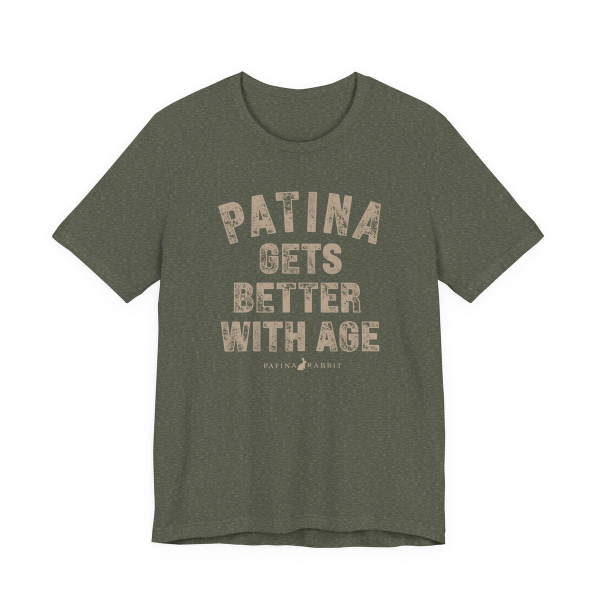 An olive green heathered t-shirt with a distressed beige graphic text that reads 'PATINA GETS BETTER WITH AGE' and 'PATINA RABBIT' underneath, displayed on a solid white background.